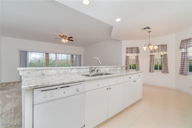 kitchen featuring white cabinetry, light stone countertops, white dishwasher, decorative light fixtures, and sink