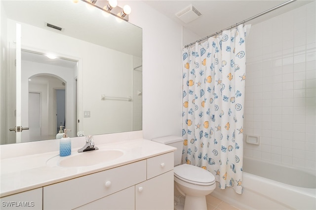 full bathroom with vanity, toilet, tile patterned floors, and shower / tub combo