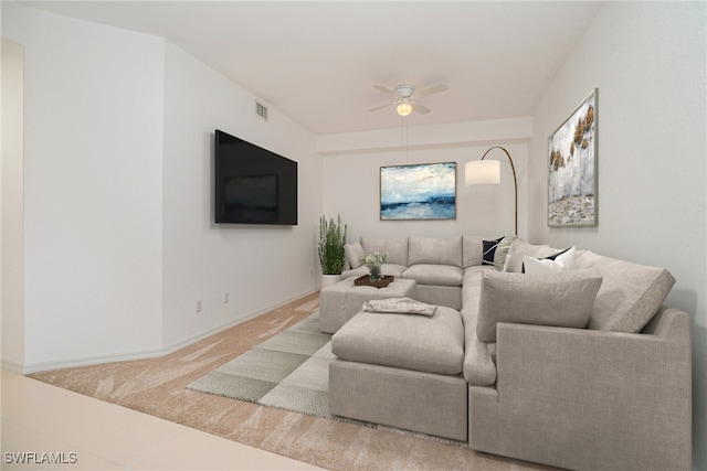 carpeted living room featuring ceiling fan