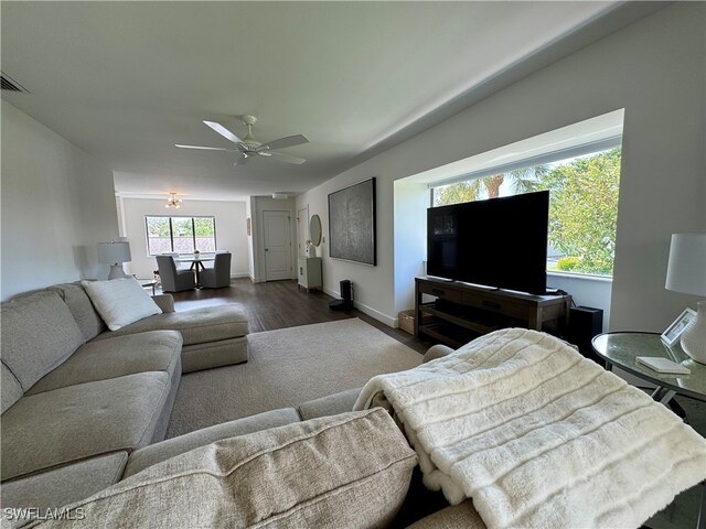 living room featuring hardwood / wood-style flooring and ceiling fan