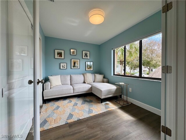 living room with dark hardwood / wood-style floors