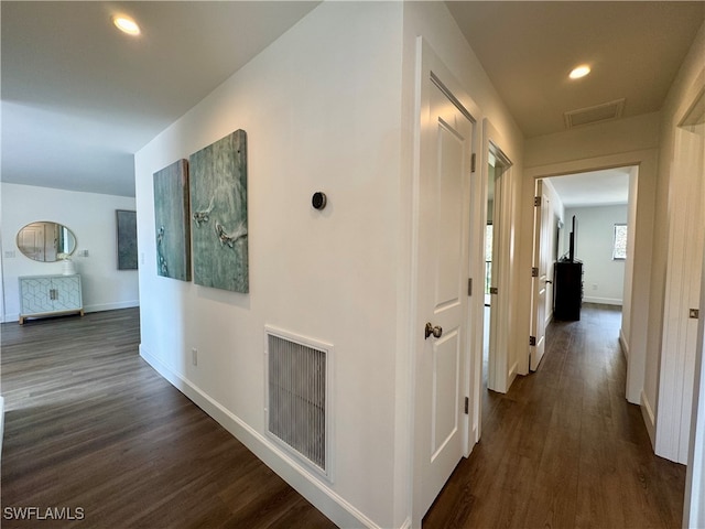 corridor featuring dark hardwood / wood-style flooring