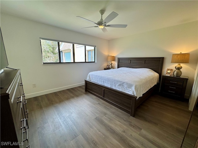 bedroom featuring ceiling fan and dark wood-type flooring