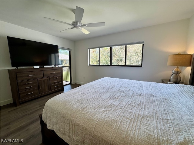 bedroom featuring ceiling fan and dark hardwood / wood-style floors