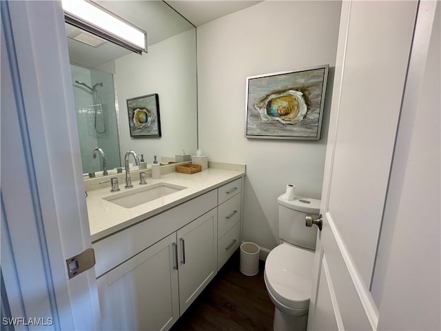 bathroom featuring hardwood / wood-style floors, vanity, and toilet