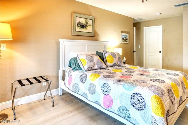 bedroom featuring hardwood / wood-style flooring