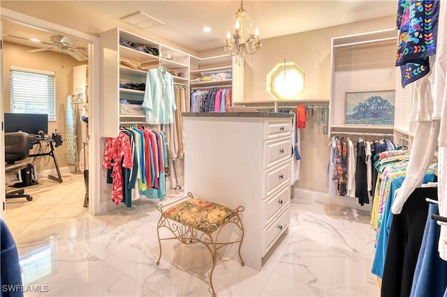 spacious closet with ceiling fan with notable chandelier