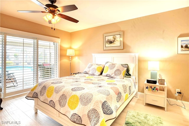 bedroom featuring light hardwood / wood-style flooring and ceiling fan