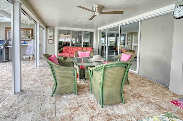 sunroom / solarium with ceiling fan