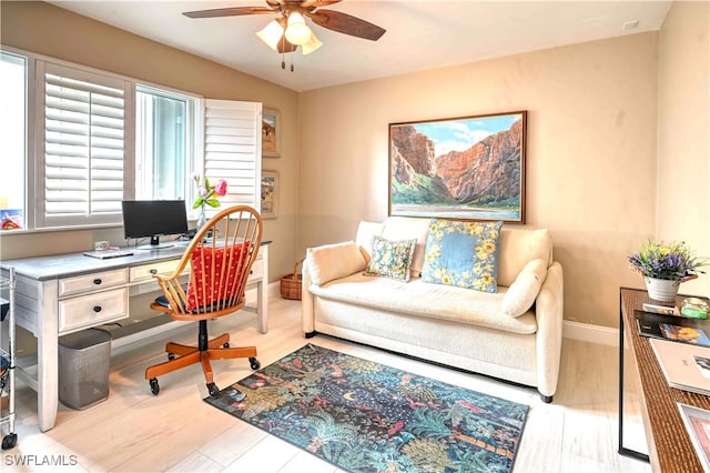 office area with ceiling fan and light hardwood / wood-style flooring