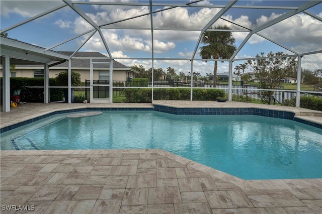 view of pool with a lanai and a patio