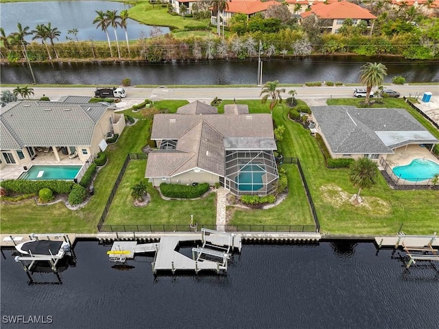 birds eye view of property featuring a water view