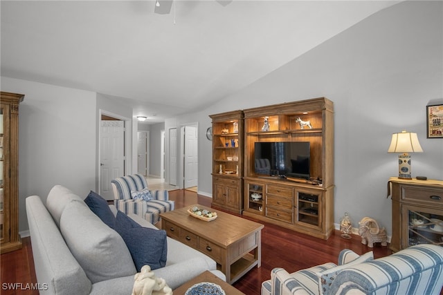 living room with dark wood-type flooring, ceiling fan, and vaulted ceiling