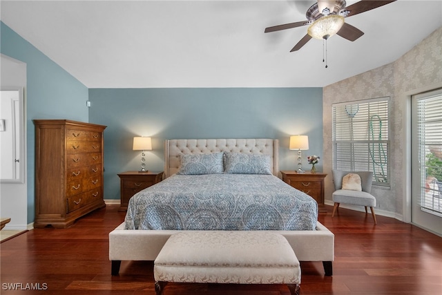 bedroom featuring lofted ceiling, access to exterior, dark wood-type flooring, and ceiling fan