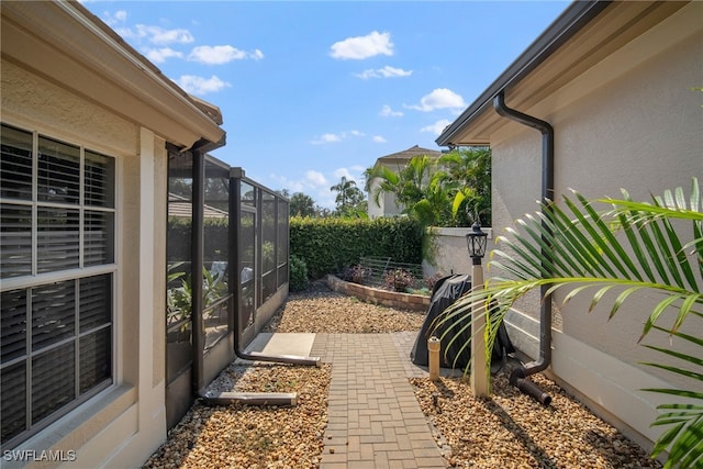 view of yard featuring a lanai