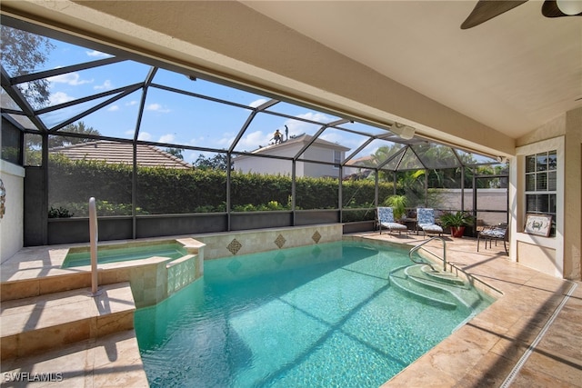 view of pool featuring an in ground hot tub, ceiling fan, a patio, and a lanai