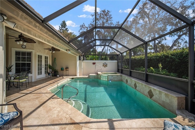 view of pool with a patio, glass enclosure, french doors, and ceiling fan