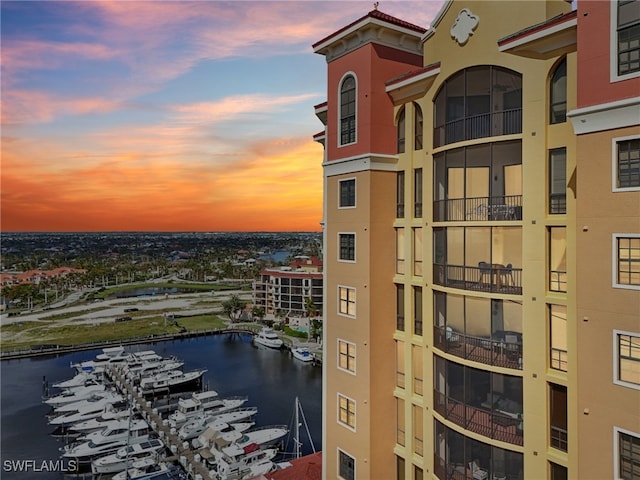 outdoor building at dusk featuring a water view