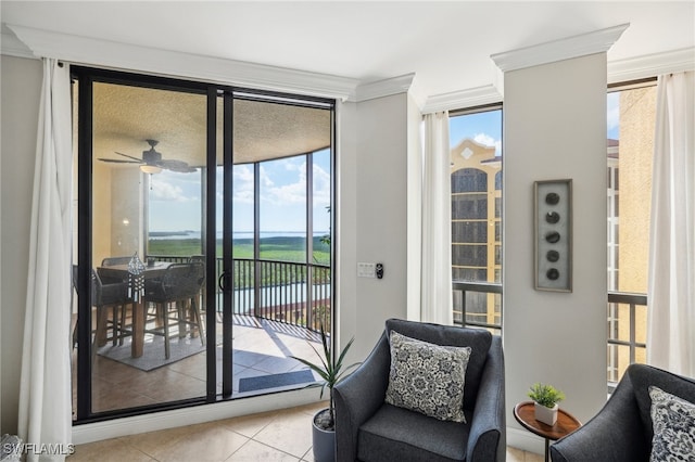 entryway featuring a wall of windows, light tile patterned flooring, ceiling fan, and plenty of natural light