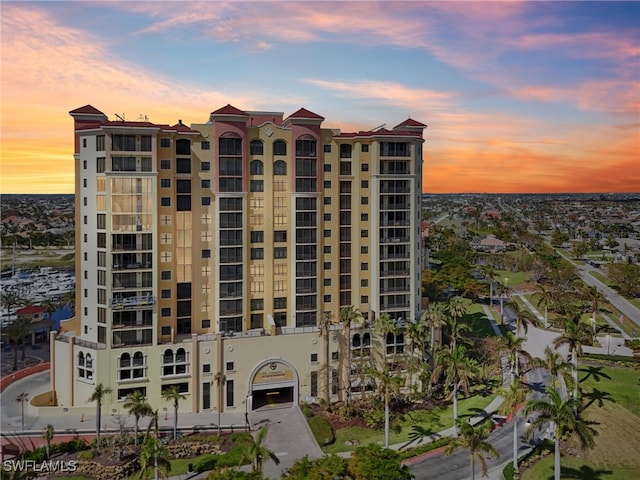 view of outdoor building at dusk