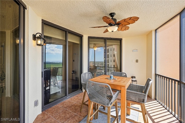 sunroom / solarium with ceiling fan and plenty of natural light