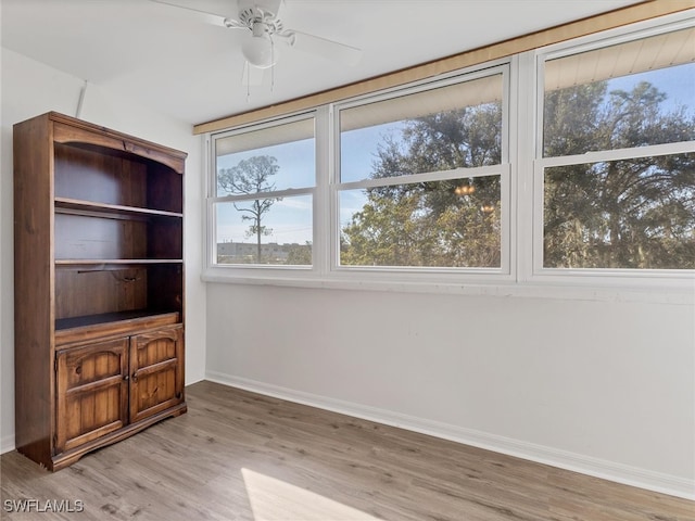 interior space featuring light wood-type flooring and ceiling fan