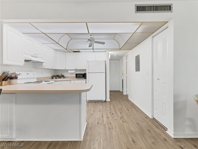 kitchen featuring light hardwood / wood-style floors, kitchen peninsula, white cabinets, and white appliances