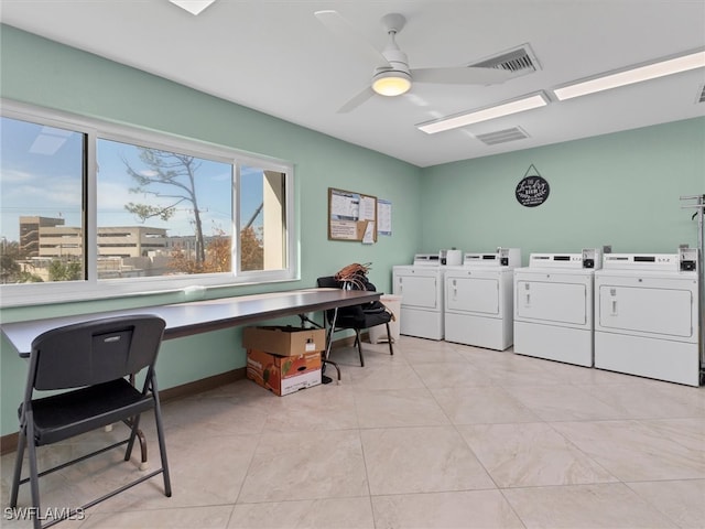 clothes washing area featuring ceiling fan, light tile patterned floors, and washing machine and clothes dryer