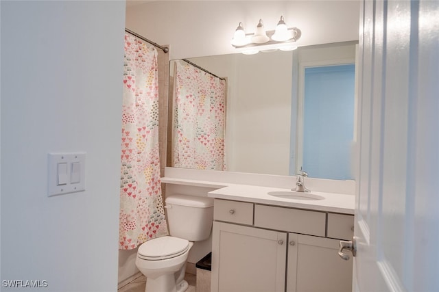 bathroom with vanity, toilet, tile patterned floors, and walk in shower