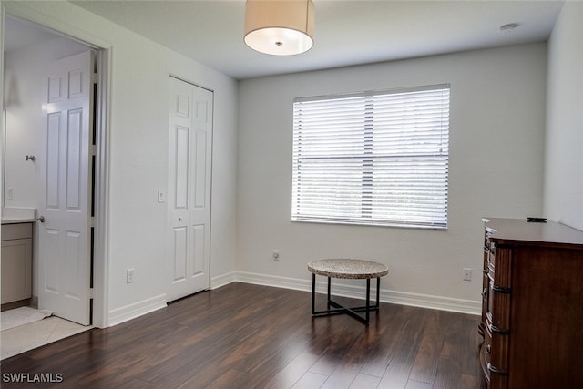 bedroom featuring a closet and dark hardwood / wood-style floors