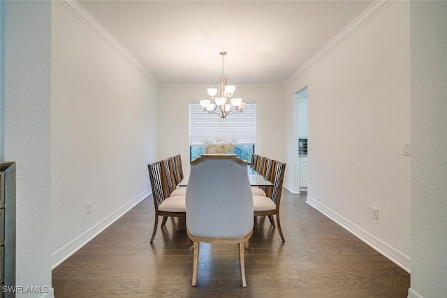 dining area with dark wood-type flooring, crown molding, and a chandelier