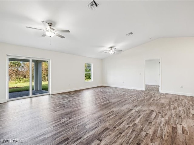 spare room with vaulted ceiling, hardwood / wood-style flooring, and ceiling fan