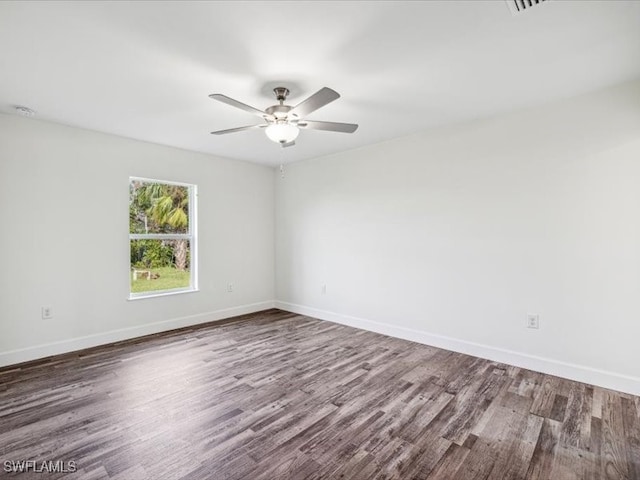 spare room featuring ceiling fan and hardwood / wood-style floors