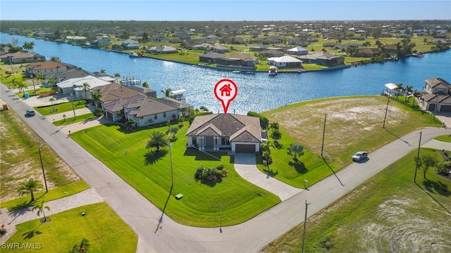 birds eye view of property with a water view