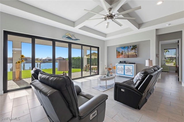 living room featuring beamed ceiling, light tile patterned flooring, and ceiling fan