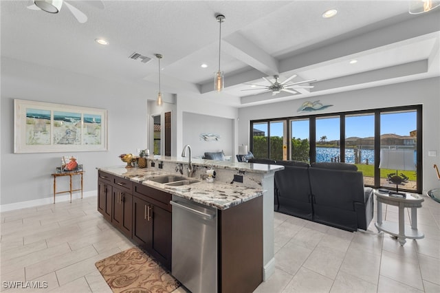 kitchen featuring hanging light fixtures, stainless steel dishwasher, sink, and plenty of natural light