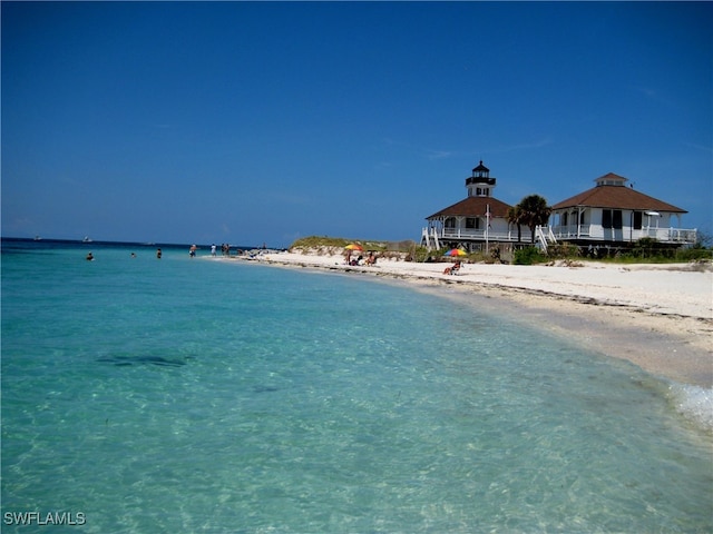 property view of water featuring a beach view