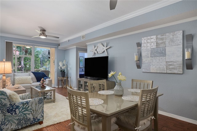 dining space featuring crown molding, wood-type flooring, and ceiling fan