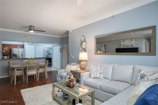 living room featuring ornamental molding, ceiling fan, and dark hardwood / wood-style flooring