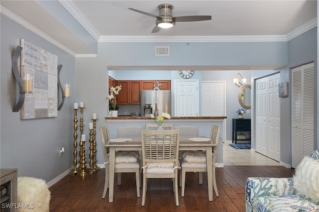 dining space with crown molding, dark hardwood / wood-style floors, and ceiling fan