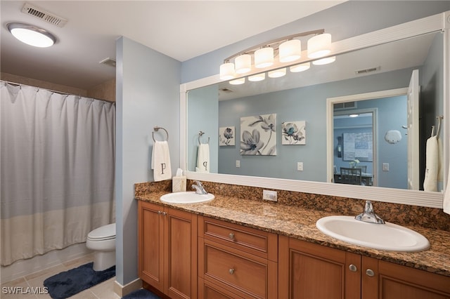 full bathroom with vanity, shower / bath combo with shower curtain, toilet, and tile patterned floors