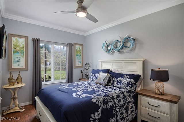 bedroom featuring dark hardwood / wood-style flooring, ornamental molding, and ceiling fan