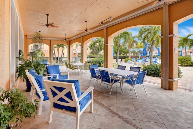 view of patio / terrace with an outdoor living space and ceiling fan