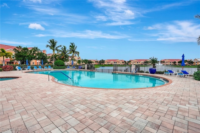 view of pool with a jacuzzi and a patio