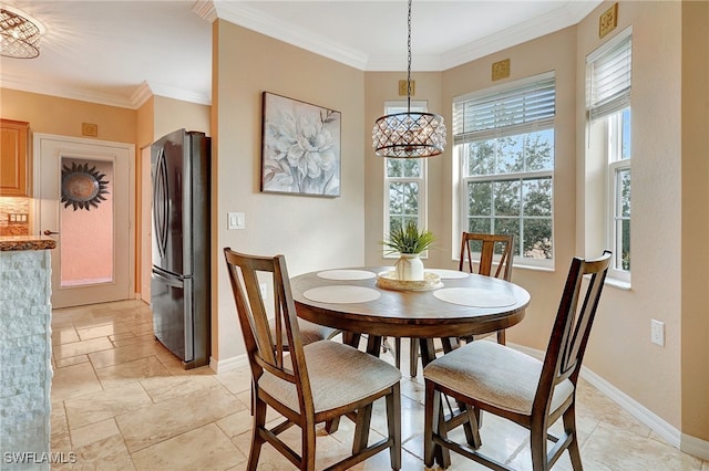 dining space with ornamental molding