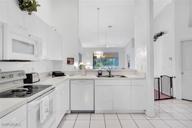 kitchen featuring white appliances, high vaulted ceiling, white cabinetry, and sink