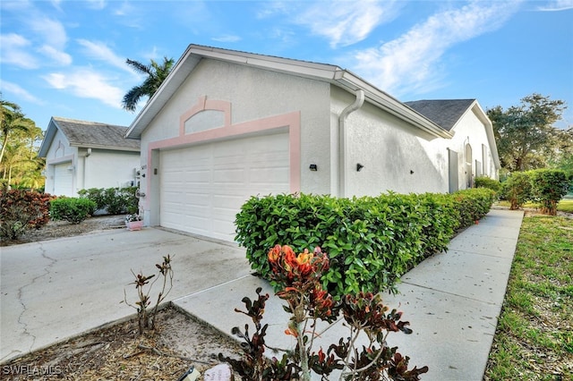 view of side of home with a garage