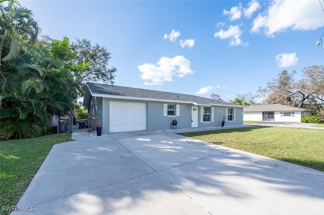 ranch-style house with a garage and a front lawn