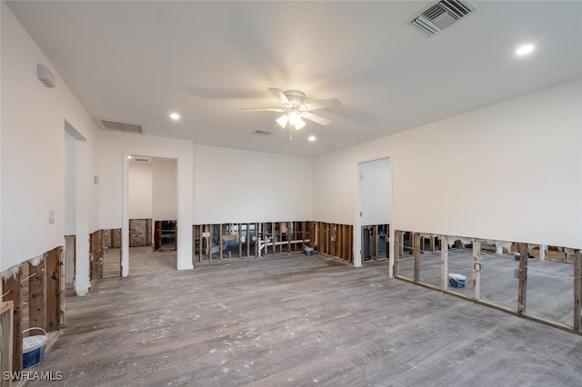 spare room featuring wood-type flooring and ceiling fan