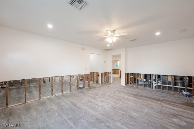 spare room featuring hardwood / wood-style floors and ceiling fan